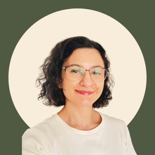 Image of a woman smiling at the camera.